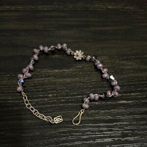 Waxing Poetic wild is the wind purple stone with daisy with brass bracelet.